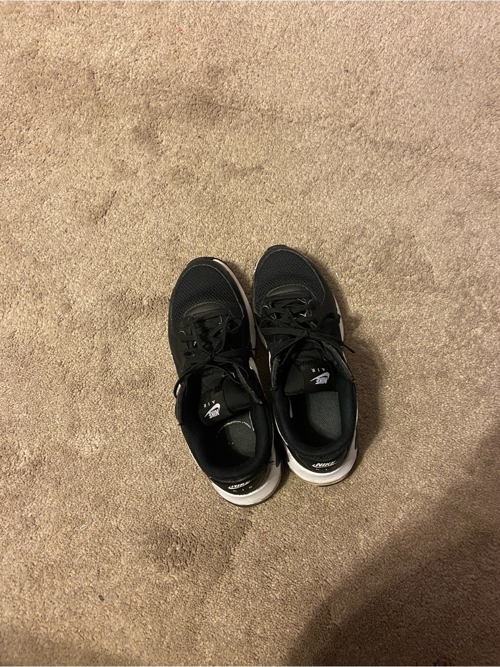Nike women  Black & White Running Sneakers used